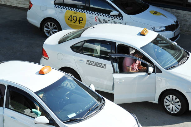 Sochi: white taxis waiting for their customers Sochi: white taxis waiting for their customers